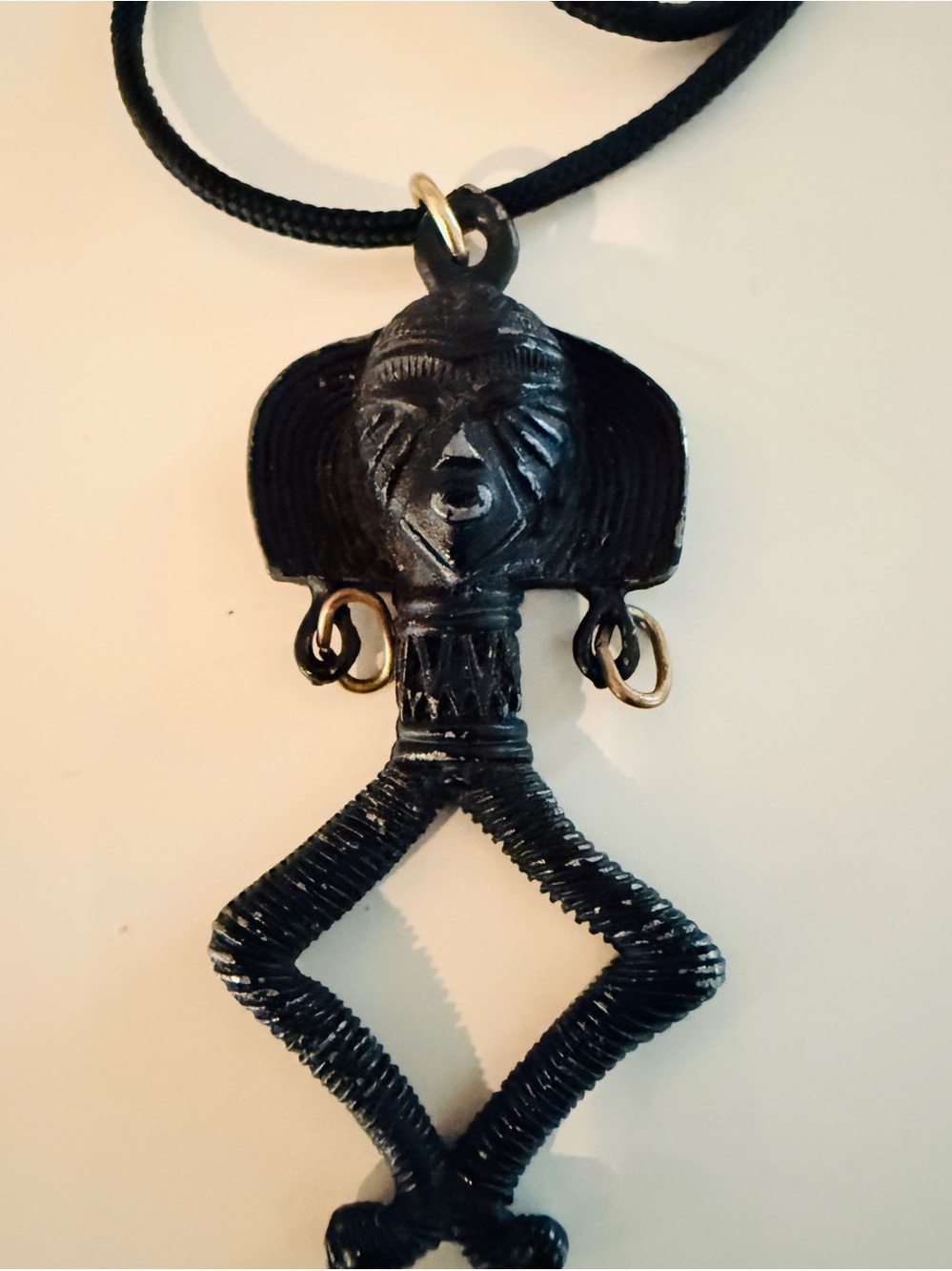 Vintage Carved Goddess of Fertility Figure Metal Pendant Necklace.